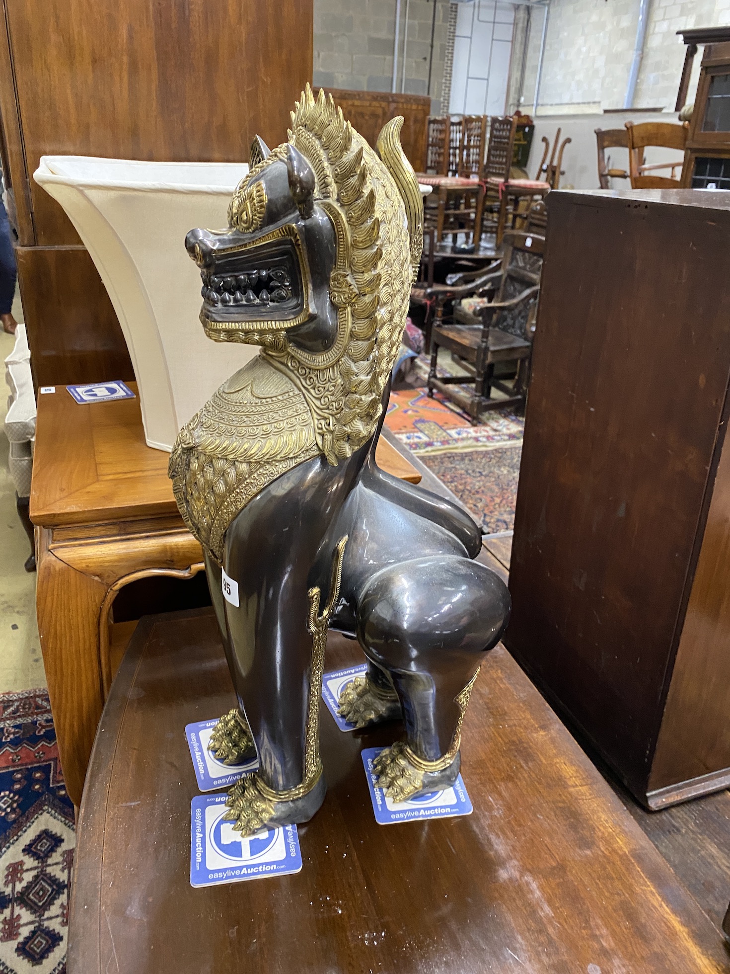 A Thai gilt metal lion dog, height 60cm